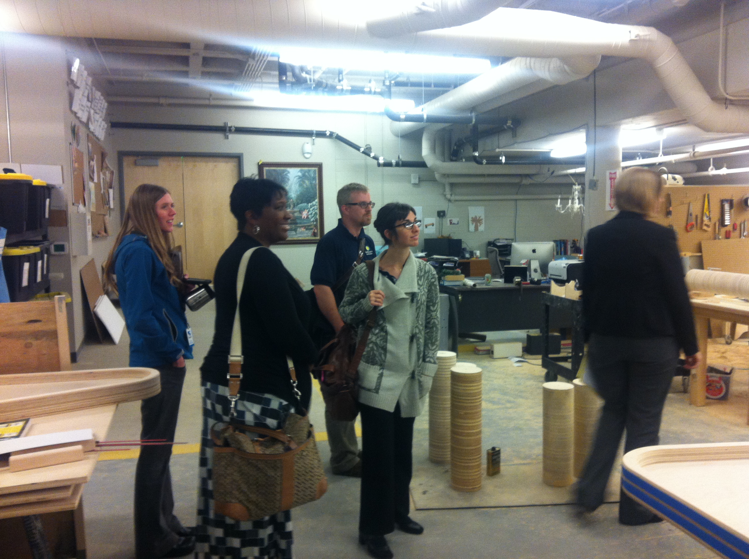 The Spark!Lab team touring the workshop at The Discovery 