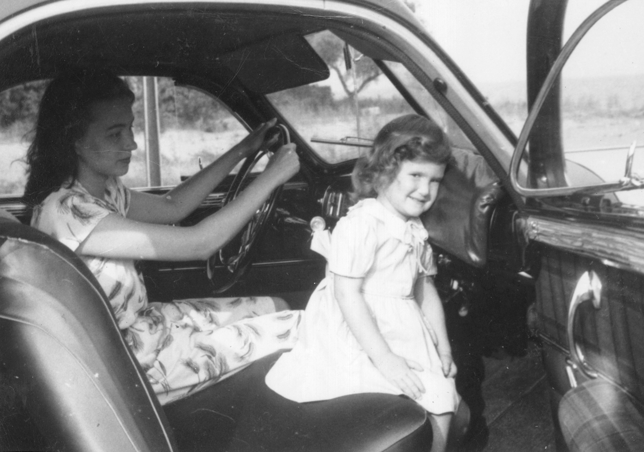 The Straith padded dashboard is demonstrated in this photo by the inventor’s daughter, Jean Straith Hepner, and granddaughter, Grace Quitzow.