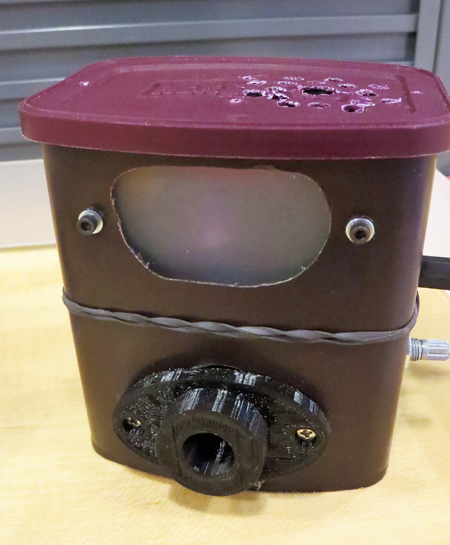 A modified cocoa can used as the laser target