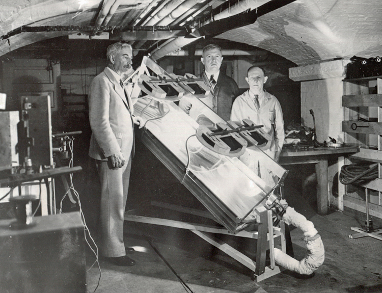 Smithsonian Secretary Charles G. Abbot with assistants testing a solar engine, 1935