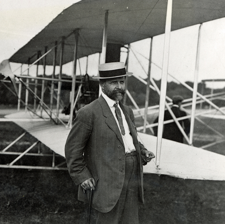 William Hammer standing alongside the Wright Type A Military Flyer 