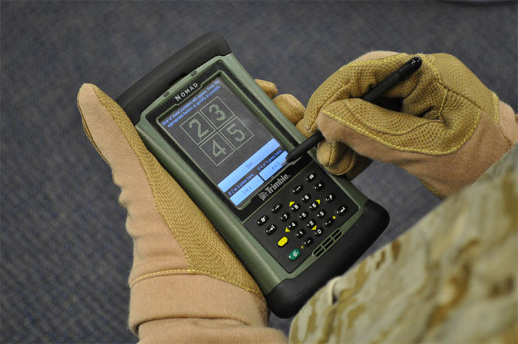 Close-up of the handheld DANA device, which looks like an older PALM personal assistant