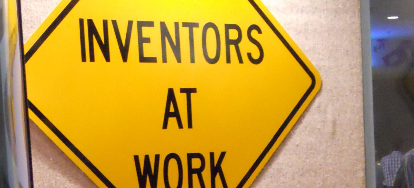 Traffic sign that reads "Inventors at Work."