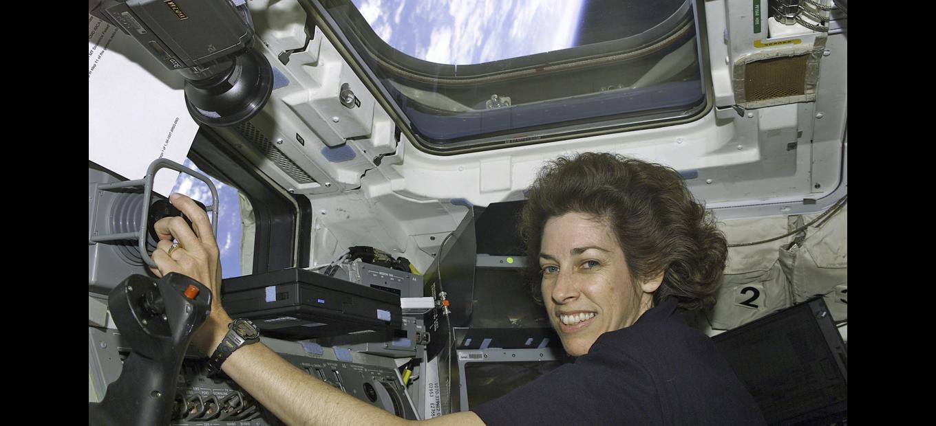 Astronaut Ellen Ochoa on the Atlantis flight deck, 15 April 2002