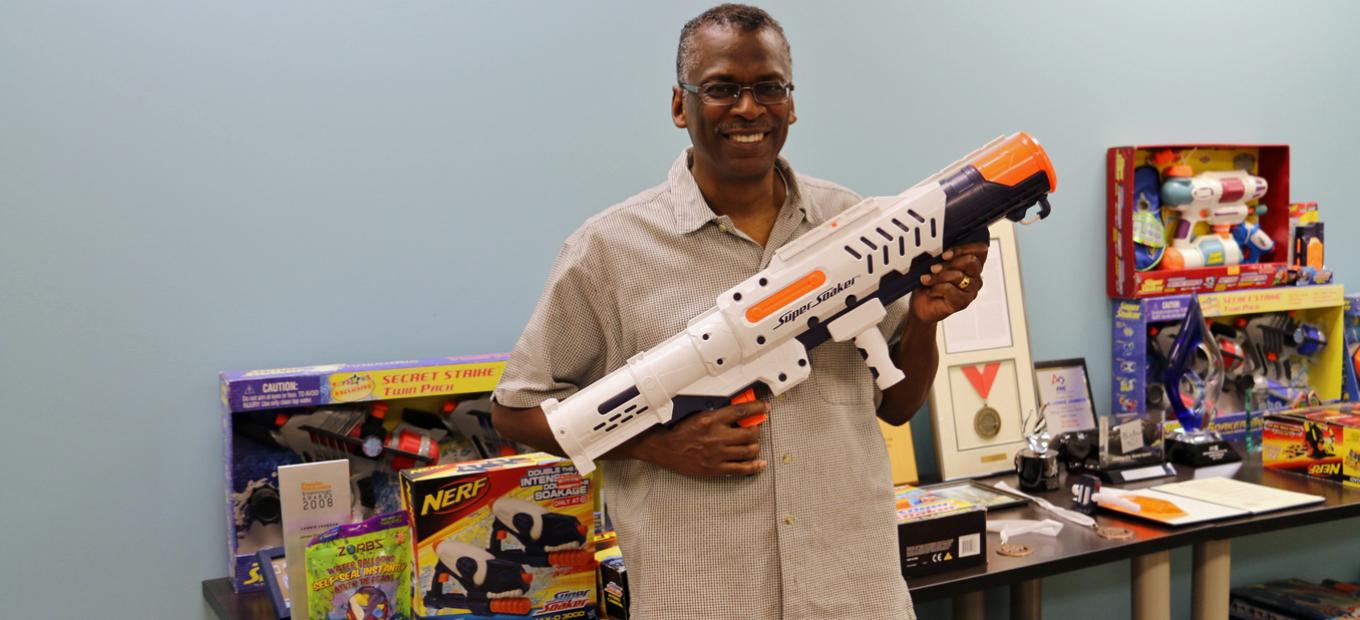 Lonnie Johnson with Super Soaker and Nerf toys