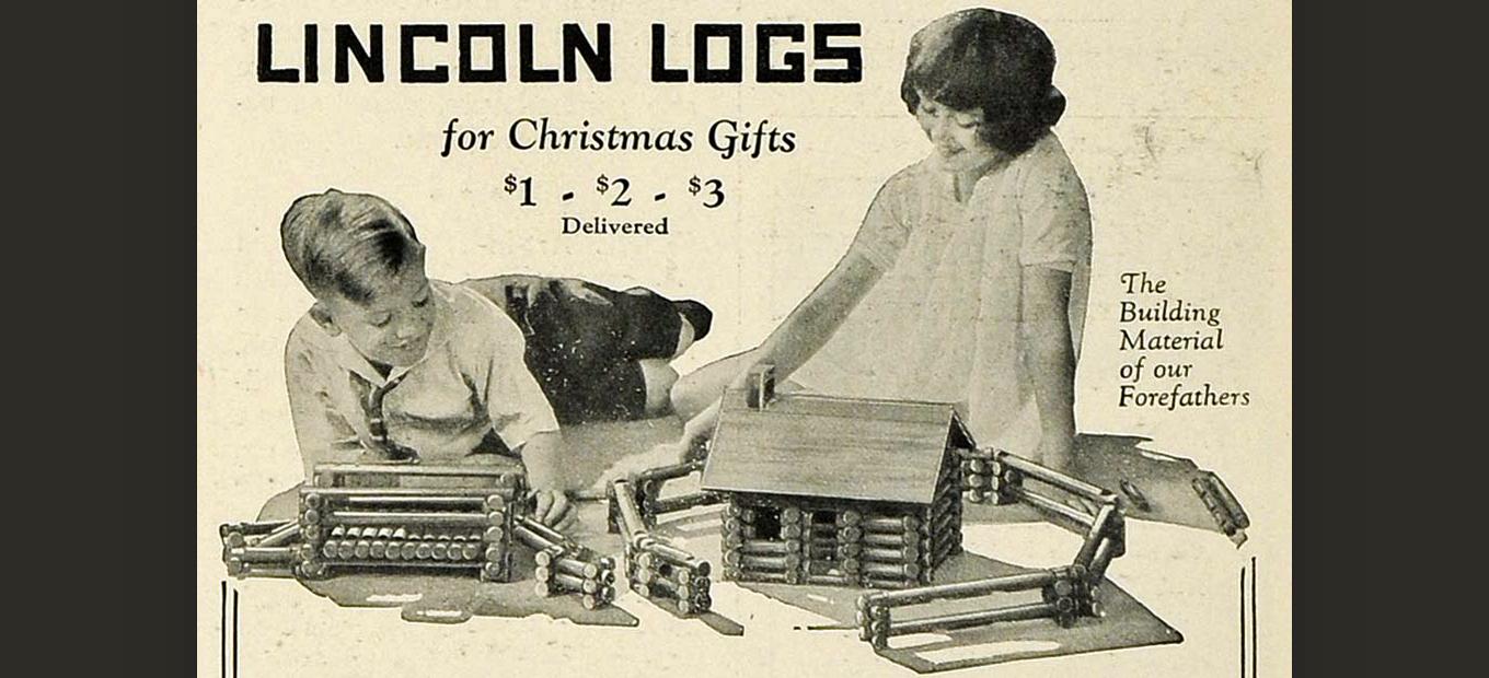1925 black-and-white print ad for Lincoln Logs, showing a young boy and girl playing with the toy. Caption reads: Lincoln Logs for Christmas Gifts. $1 $2 $3 delivered.