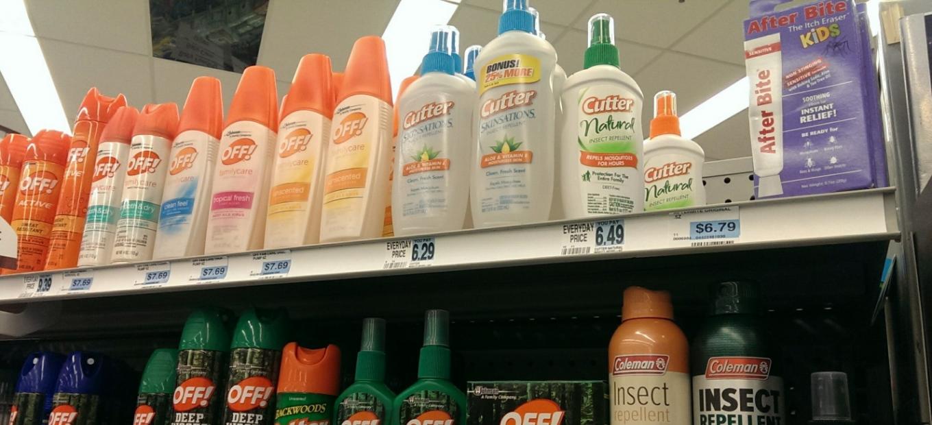 Stock image of insect repellent products on a store shelf.