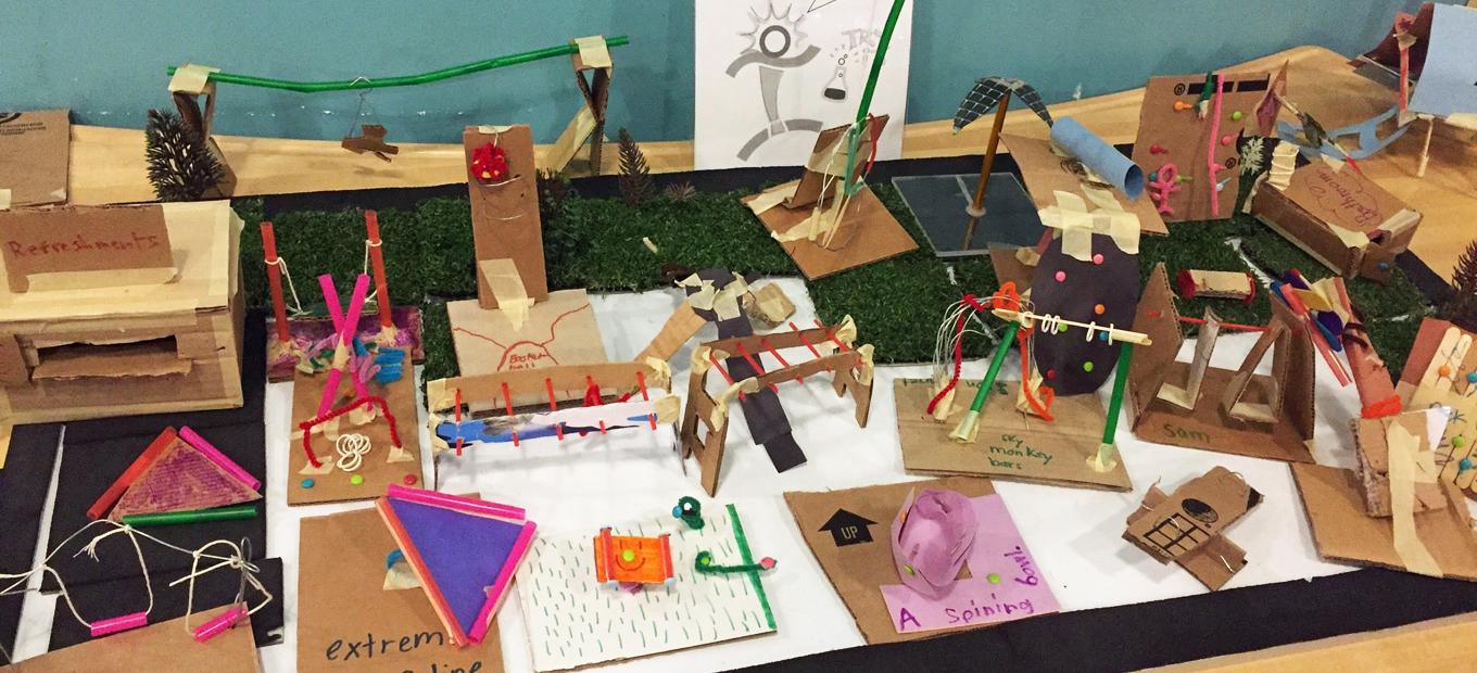 Playground equipment imagined and made by visitors from cardboard and pipe cleaners and other craft materials.