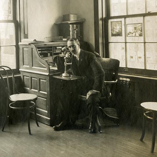 Photo of Charles Pratt in his office around 1900