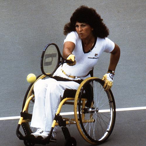 Hamilton playing tennis in a wheelchair