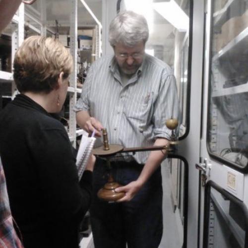 Curator Steve Turner with a scientific instrument